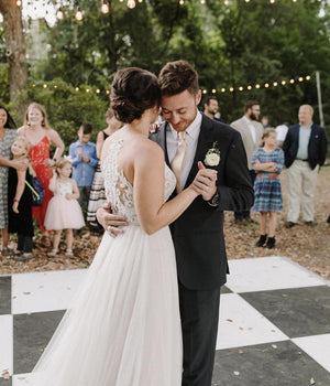 A photo of a bride and groom dancing at a garden wedding venue at Charleston Tea Garden.