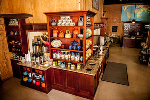 An image of Charleston Tea Garden gift shop with unique tea gifts, a tea farm with a family-friendly trolley ride through the tea plantation in Charleston. 
