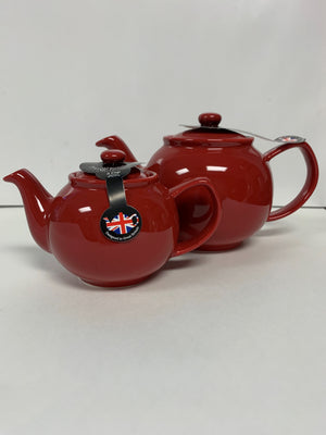 Two glossy red teapots in classic style, one smaller and one larger, both with round bodies and curved spouts, displayed on a plain white background.