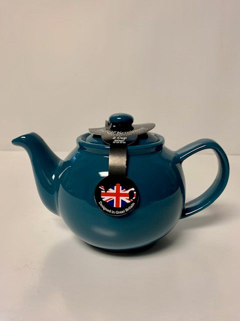 Glossy teal ceramic teapot with a classic round shape and a tag featuring the British flag, designed for brewing two to six cups of tea.