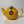 Bright yellow ceramic teapot with a simple rounded design and a tag featuring the British flag, ideal for brewing 2 to 6 cups of tea.