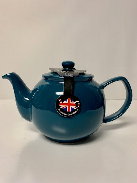 Dark teal ceramic teapot with a rounded body, curved spout, and handle, featuring a British flag tag, perfect for brewing two or six cups of tea.